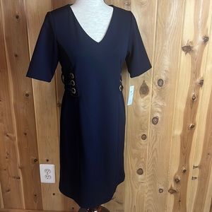 Navy blue sheath dress with side gold rings detail.